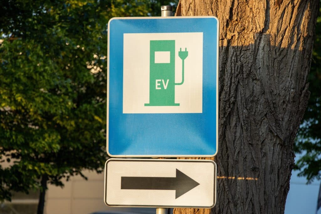EV (Electric Vehicle) charging station road sign with an arrow, Shutterstock ID#2631250539